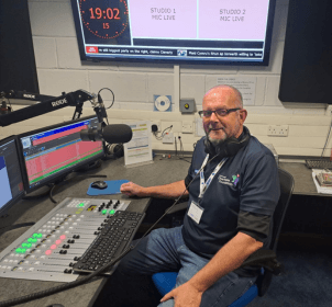 Allan Coburn at Desk.png